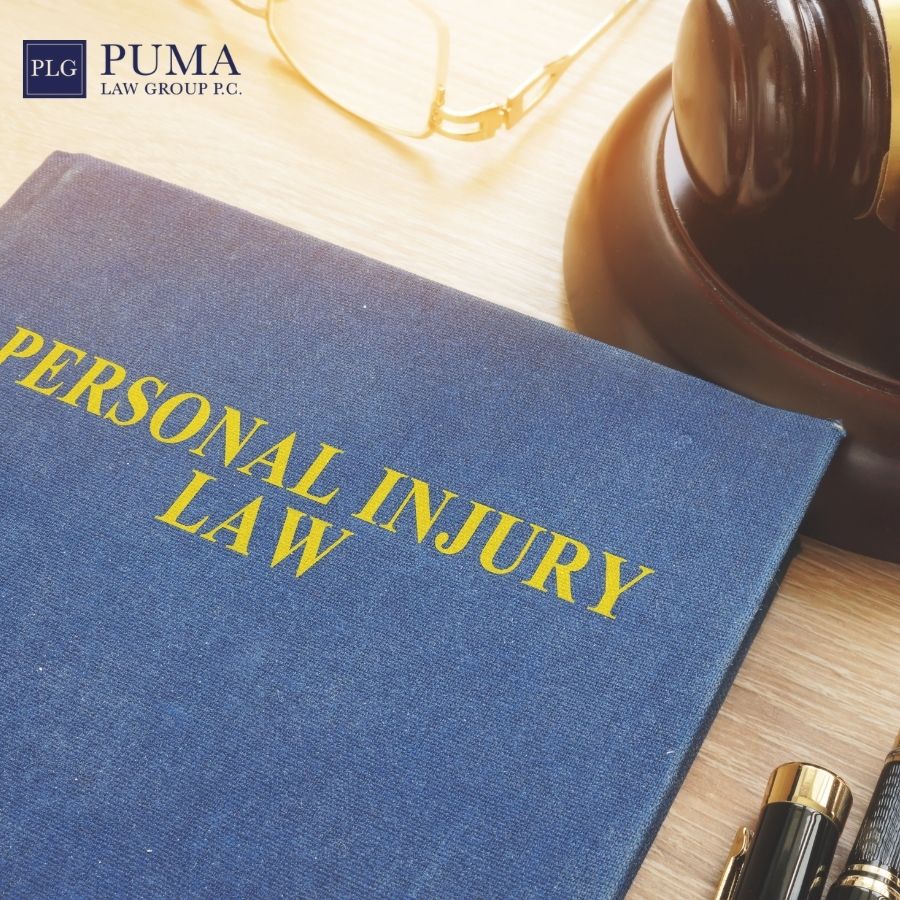 A book titled "Personal Injury Law" on a desk with a judge's gavel, eyeglasses, and a pen; Puma Law Group logo in the corner. A book titled "Personal Injury Law" on a desk with a judge's gavel, eyeglasses, and a pen; Puma Law Group logo in the corner.